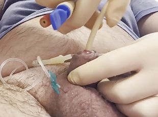 Inserting a big catheter into a small cock with big balls